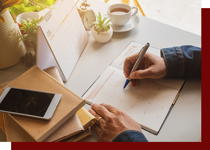 Image of someone filling out a planner