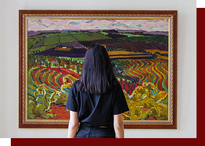 image of a woman looking at a painting